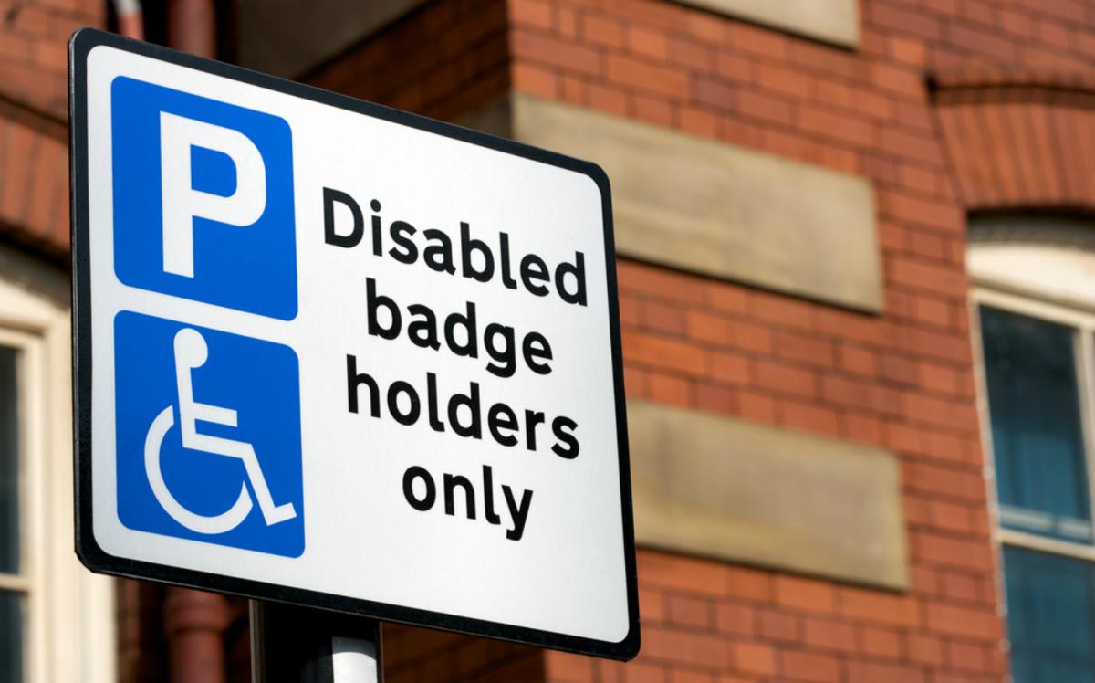 'Disabled blue badge holders only' parking sign