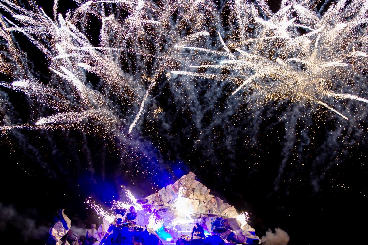 Fireworks above a pyramid shaped stage 