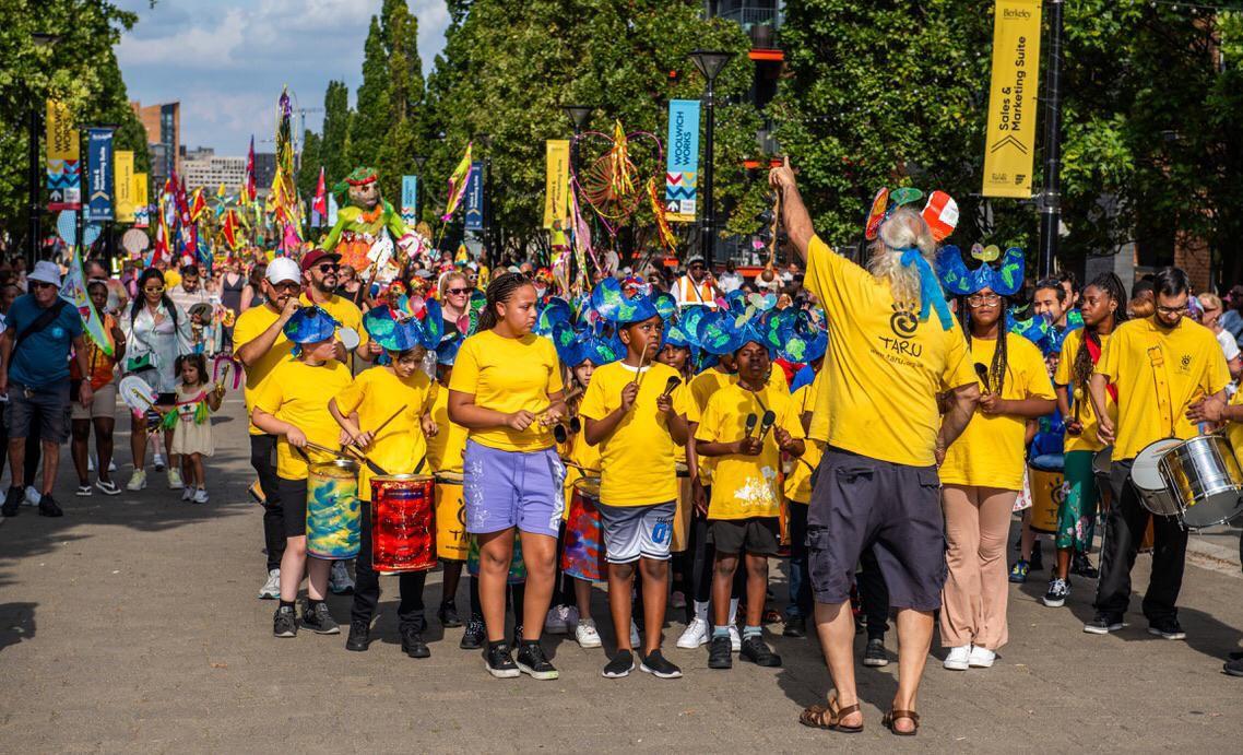 A photo of a crowd of children in a parade