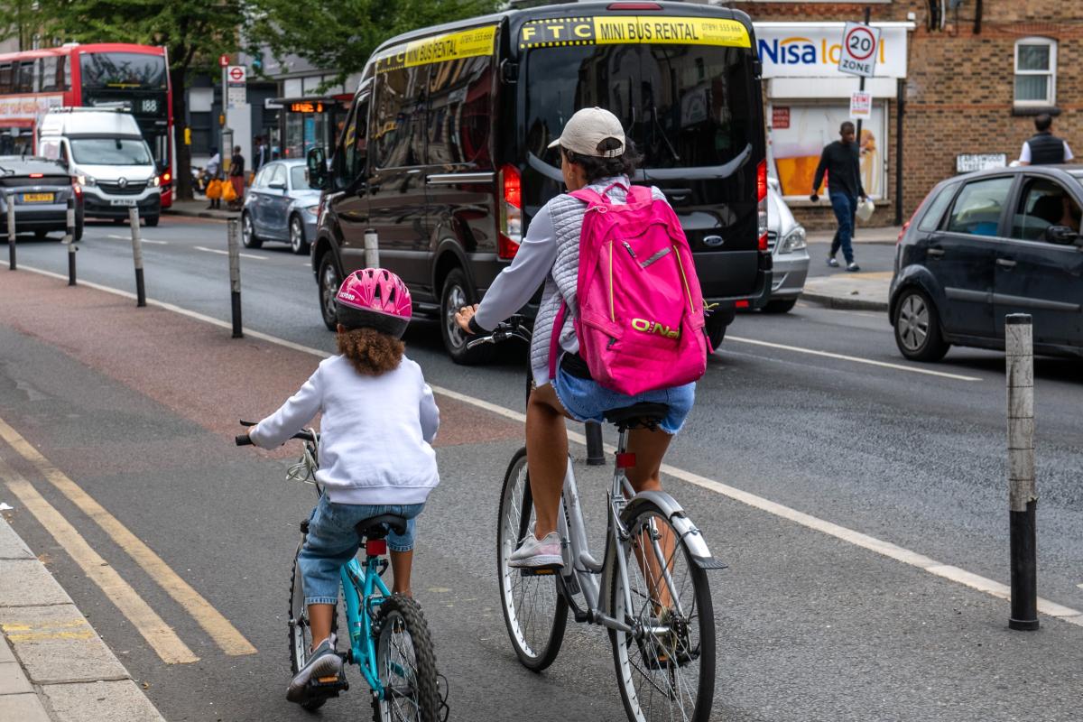 Mother and daughter cycling on Greenwich road