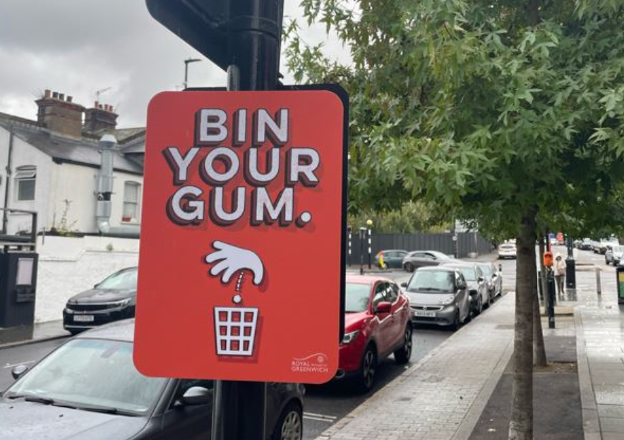 Sign on a lamp post that reads: Bin your gum