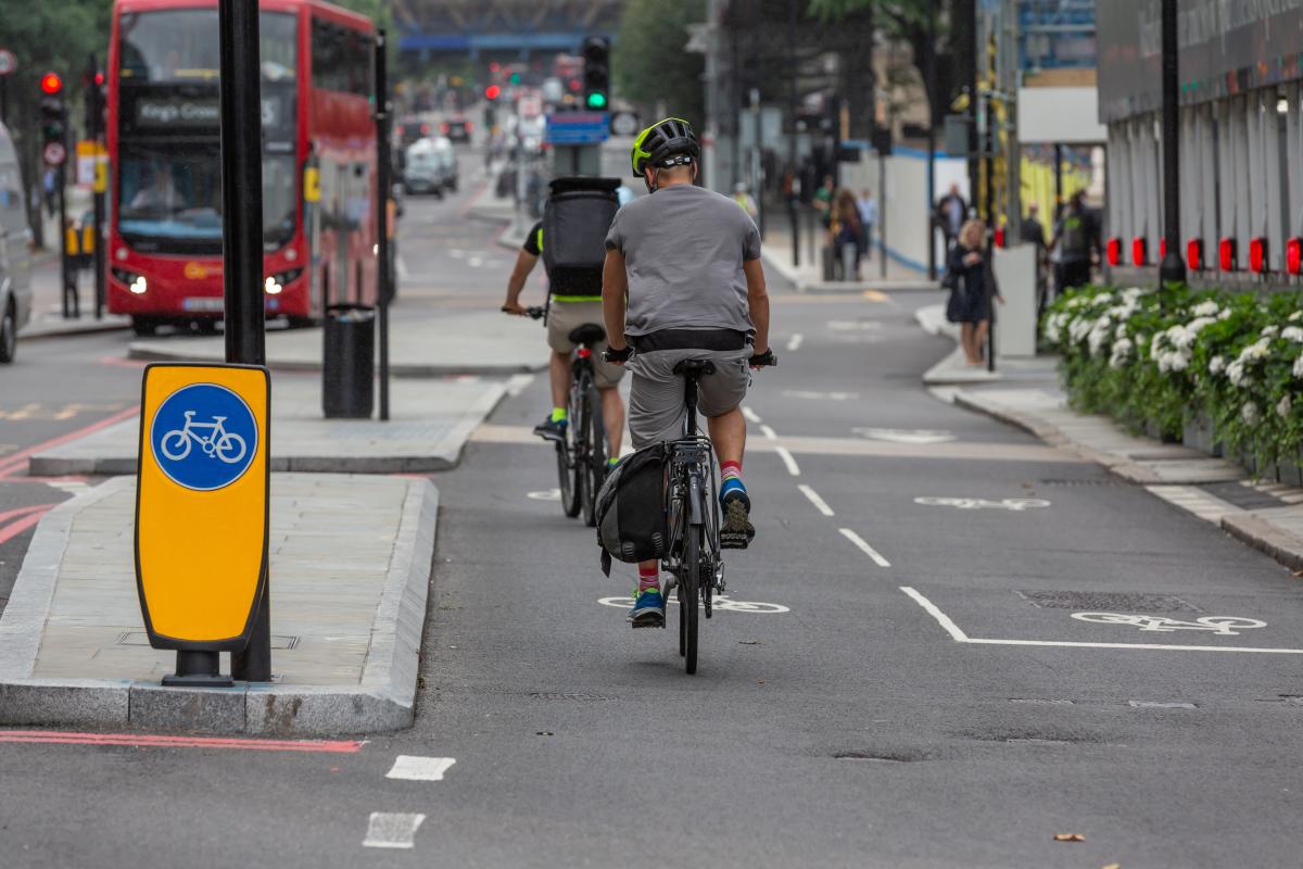 A cyclist riding his bike in a cycle lane.