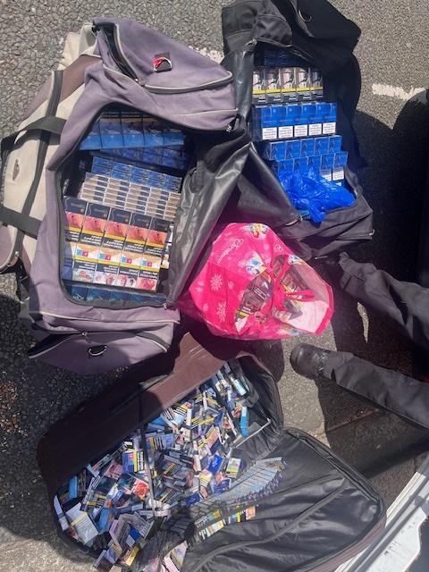 Big bags of confiscated tobacco and vapes.
