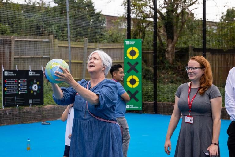 Cllr Slattery shooting hoops at Middle Park Community Centre