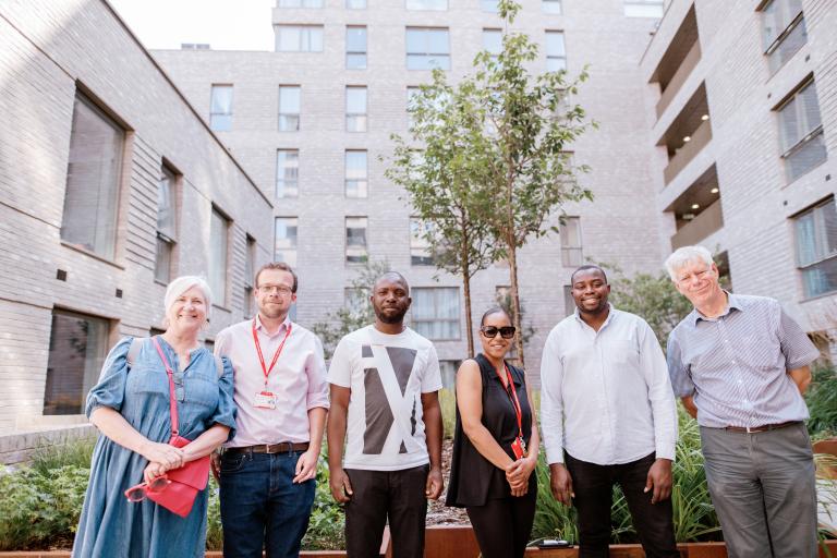 Councillors and council officers with new tenant Abiola