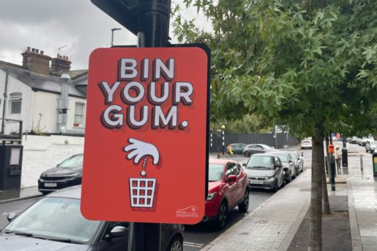 Sign on a lamp post that reads: Bin your gum