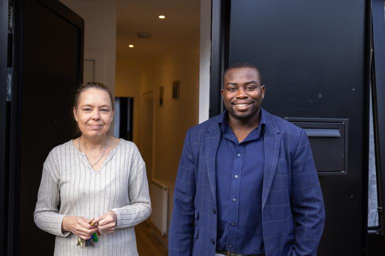 Councillor Anthony Okereke stood with resident Lisa in Tuskar Street council homes