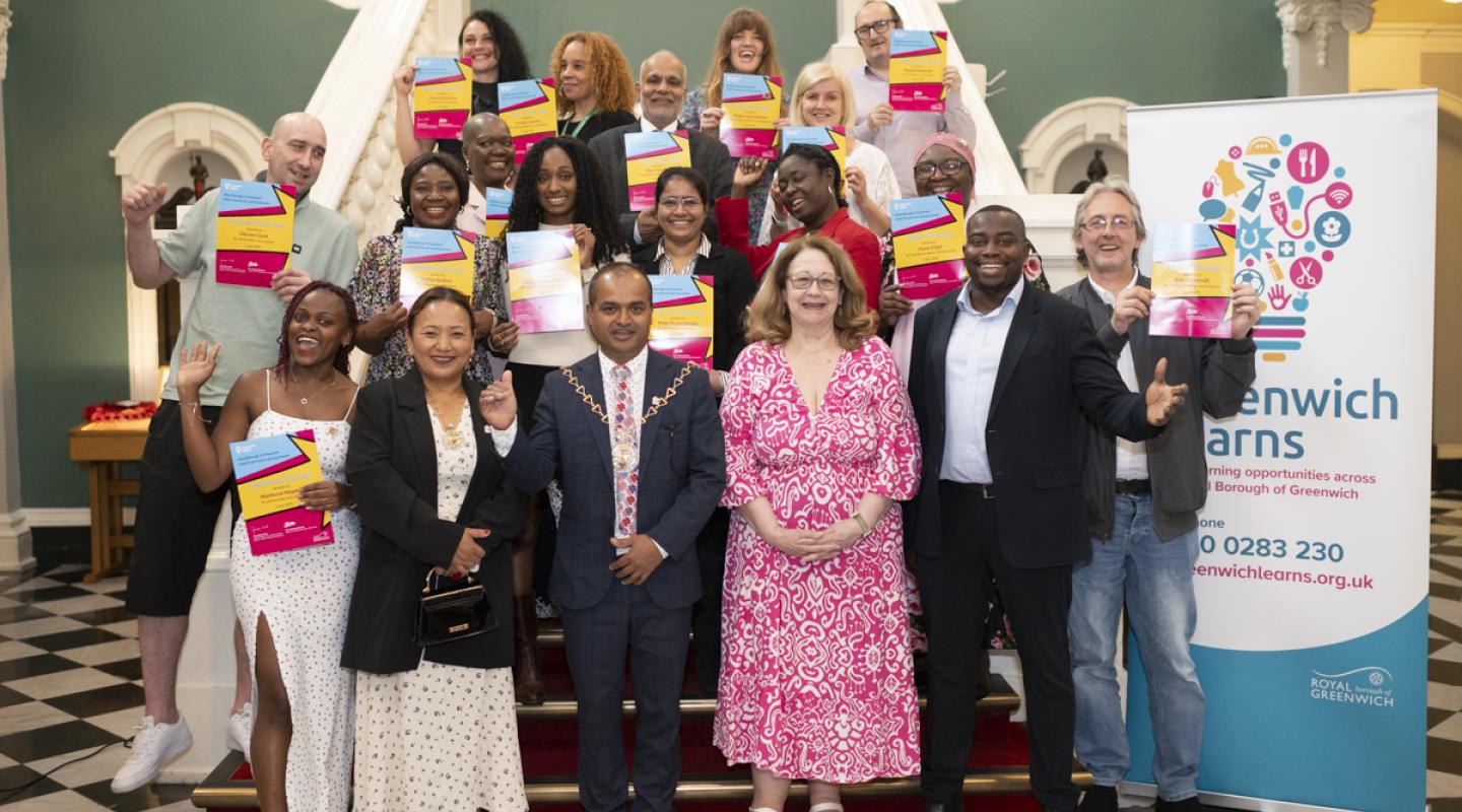 Photograph shows Cllr Anthony Okereke, Leader of the Royal Borough of Greenwich, with the Mayor - Cllr Jit Ranabhat - with a group of people celebrating the Adult Community Learning Awards inside the Woolwich Town Hall