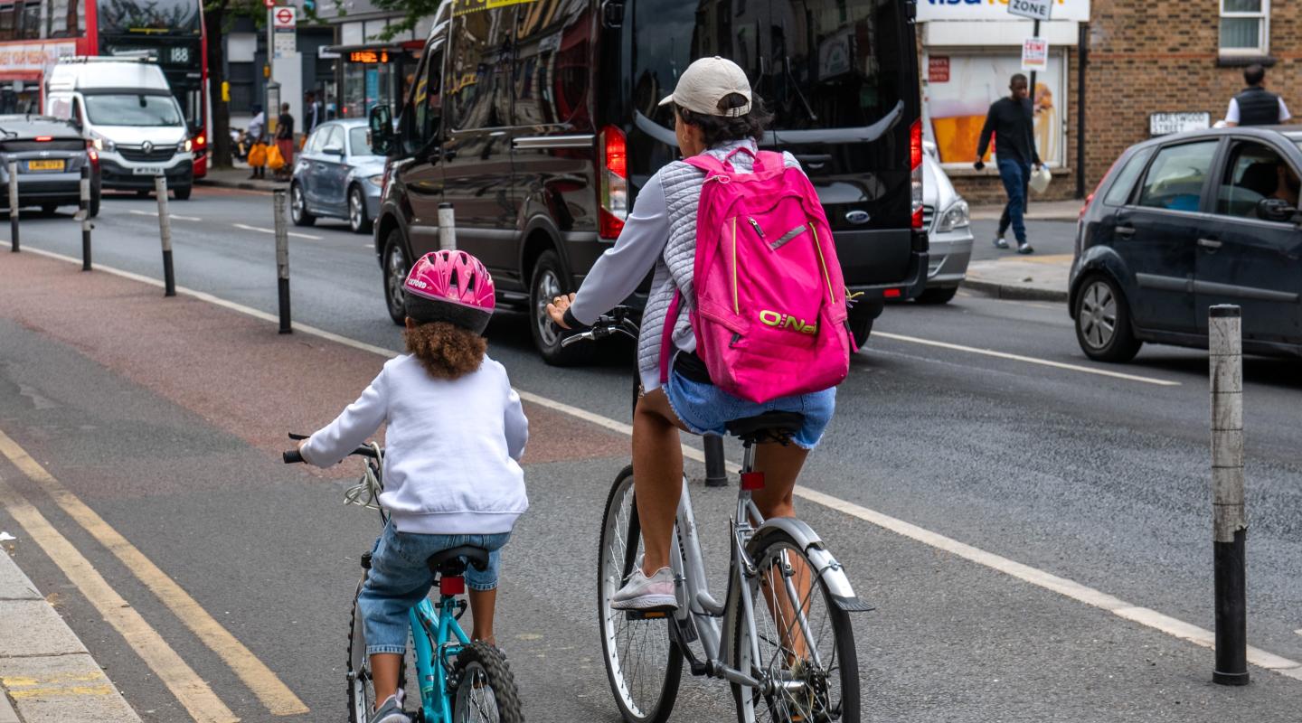 Mother and daughter cycling on Greenwich road