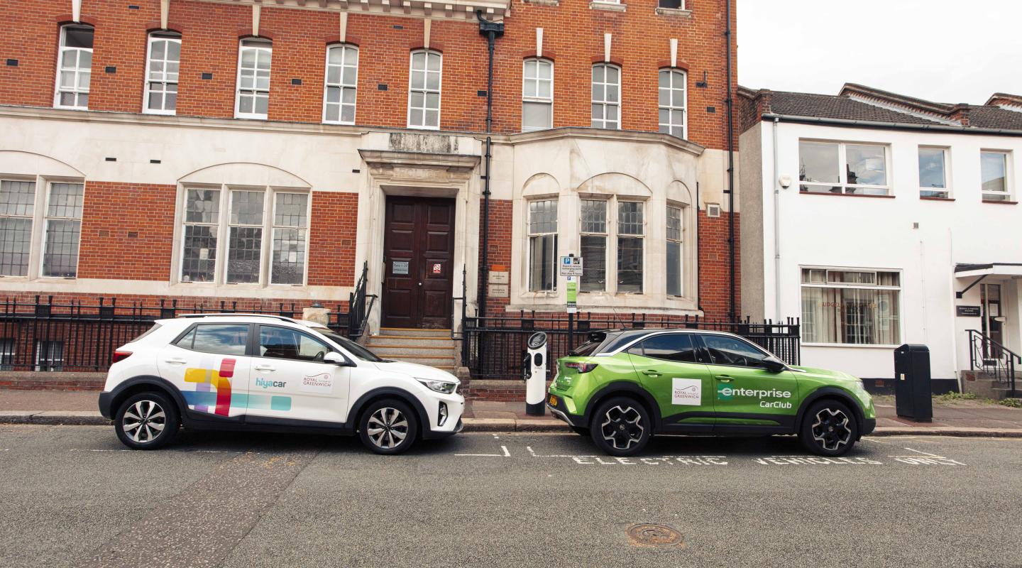 Two branded car clubs parked by the side of the road